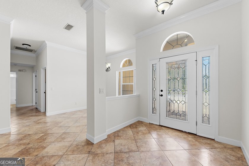 Located in the sought-after Winding River community, this - photo 3