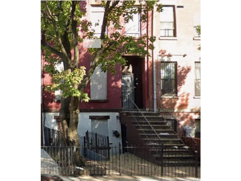 This four-story all-brick brownstone is full of potential and - photo 3