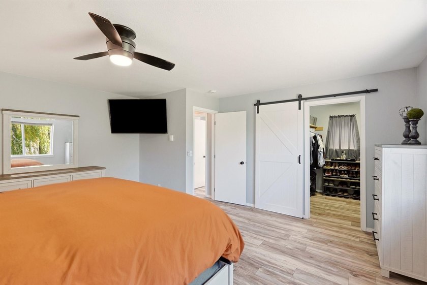 Situated on a sprawling 23-acre property along the serene shores - photo 13