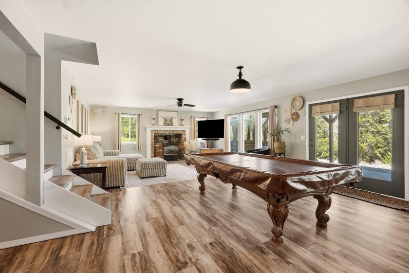Situated on a sprawling 23-acre property along the serene shores - photo 18