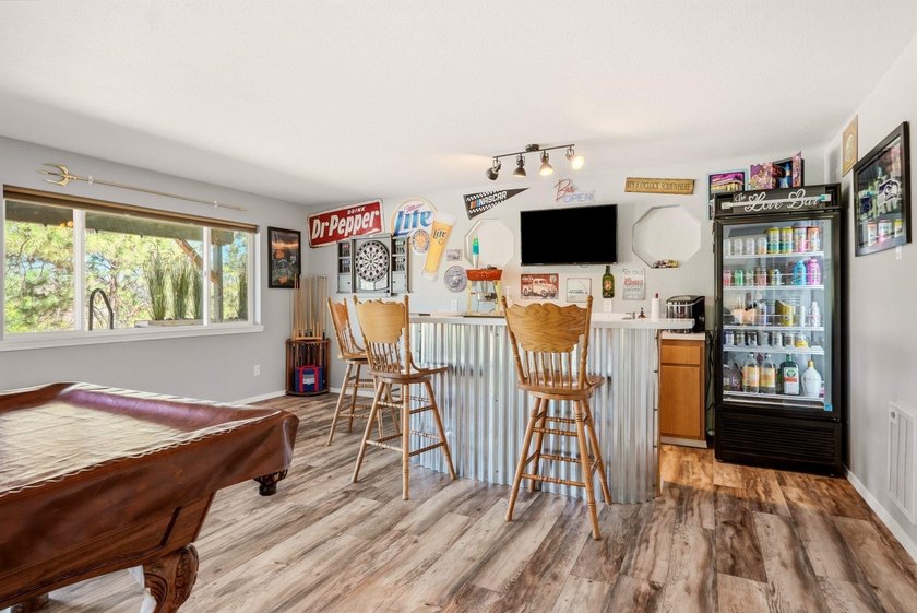 Situated on a sprawling 23-acre property along the serene shores - photo 19