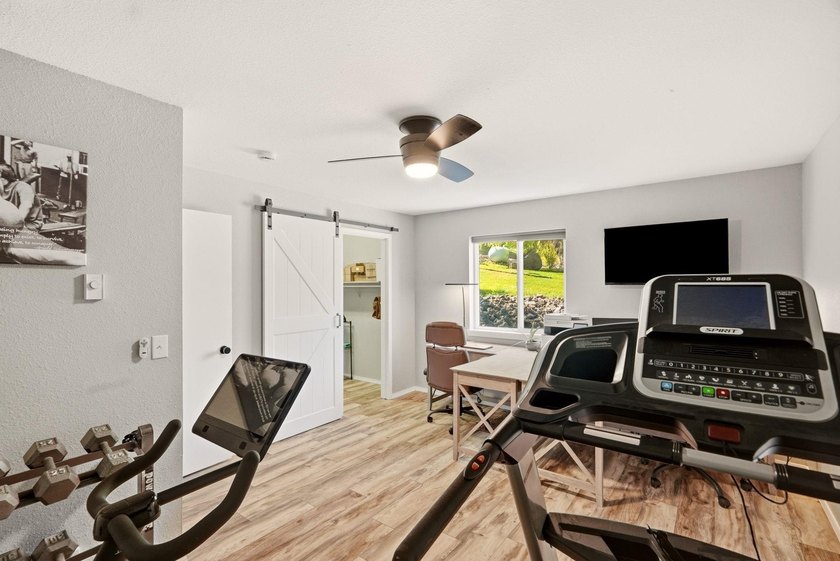 Situated on a sprawling 23-acre property along the serene shores - photo 23