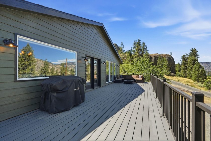 Situated on a sprawling 23-acre property along the serene shores - photo 25