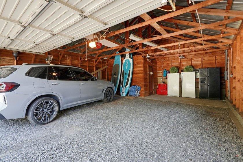 Situated on a sprawling 23-acre property along the serene shores - photo 30