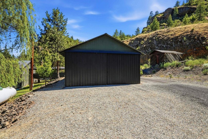 Situated on a sprawling 23-acre property along the serene shores - photo 31