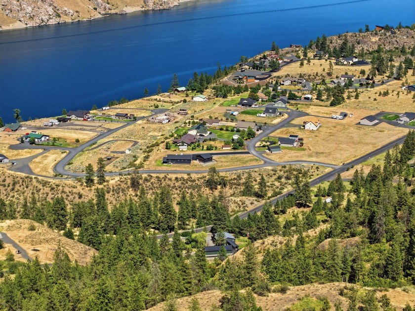 Situated on a sprawling 23-acre property along the serene shores - photo 37