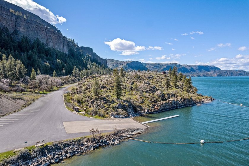 Situated on a sprawling 23-acre property along the serene shores - photo 38
