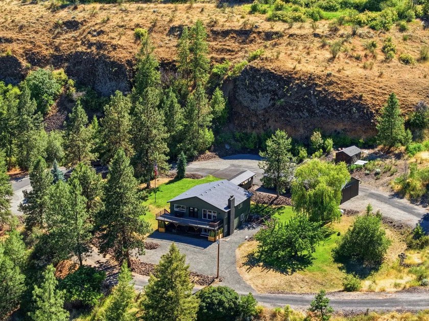 Situated on a sprawling 23-acre property along the serene shores - photo 40