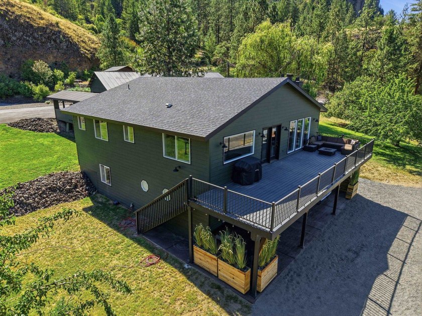 Situated on a sprawling 23-acre property along the serene shores - photo 41
