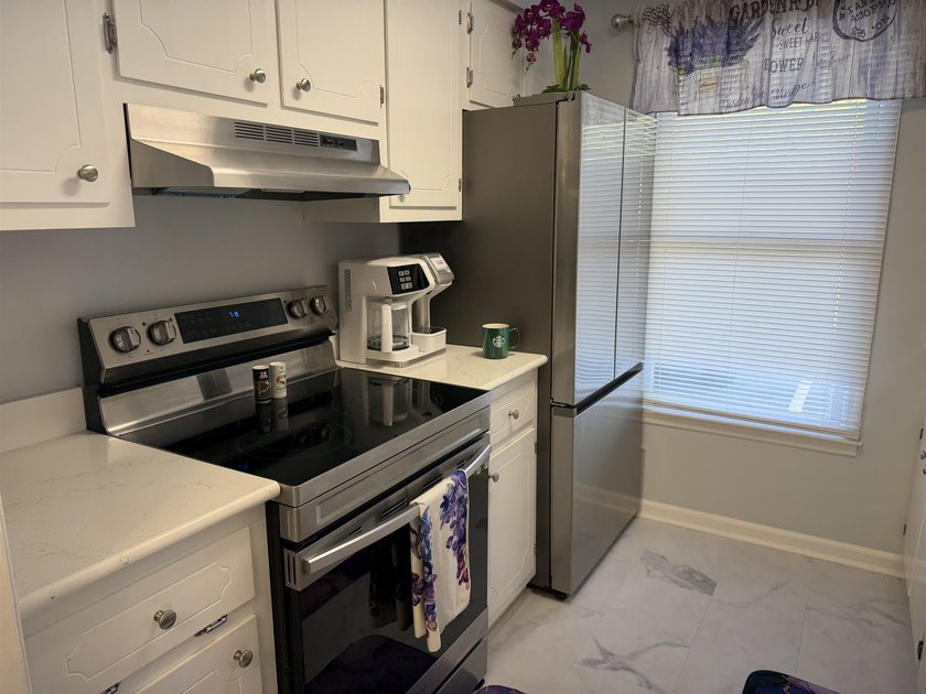 This townhouse comes fully furnished, only one block from the - photo 3