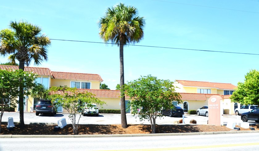 This unit boasts six separate offices plus a bathroom and a file - photo 3