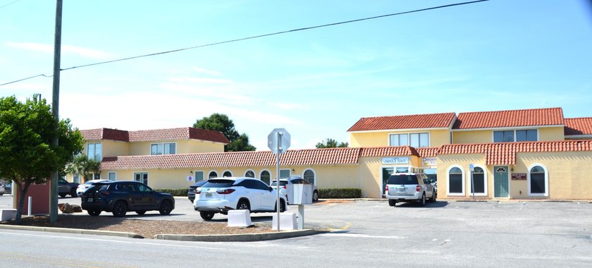 This unit boasts six separate offices plus a bathroom and a file - photo 4