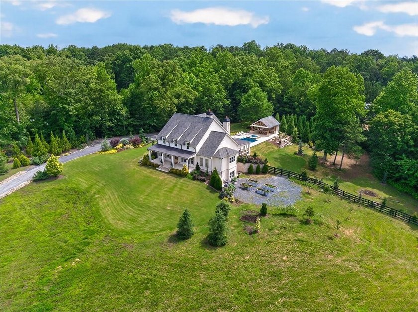 Nestled on 4.11 meticulously manicured private acres, this - photo 2