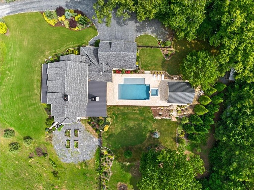 Nestled on 4.11 meticulously manicured private acres, this - photo 3