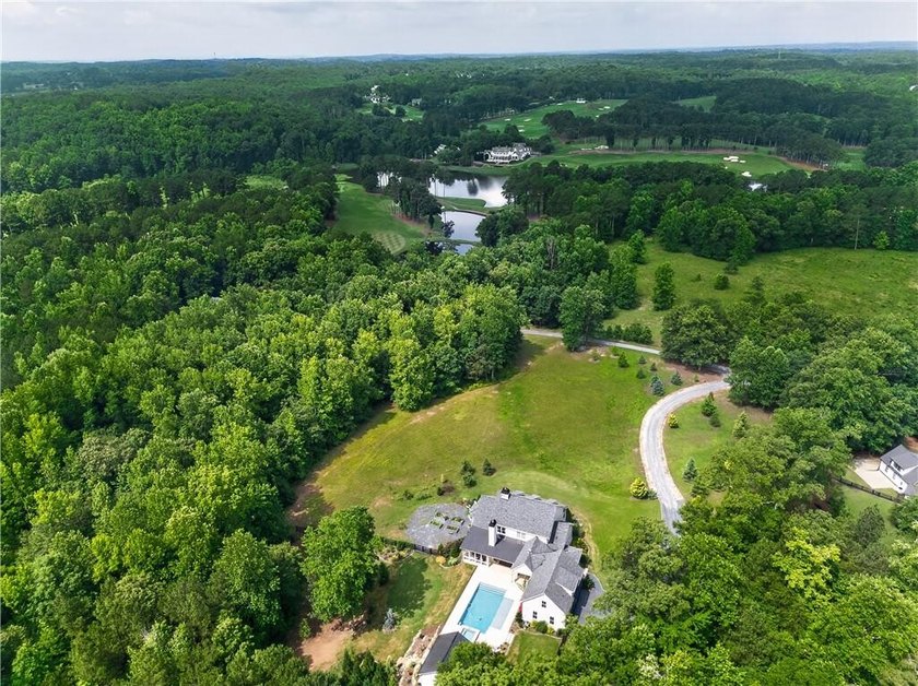 Nestled on 4.11 meticulously manicured private acres, this - photo 4