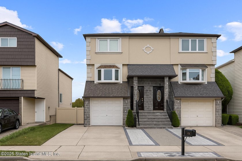 'This elegant 2 Family home features a sophisticated stocco and - photo 4