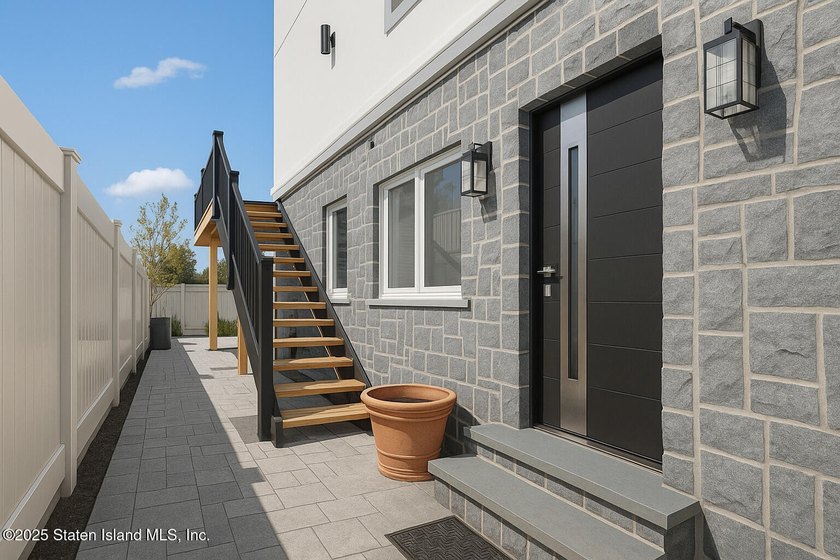'This elegant 2 Family home features a sophisticated stocco and - photo 5