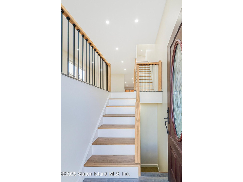 'This elegant 2 Family home features a sophisticated stocco and - photo 8