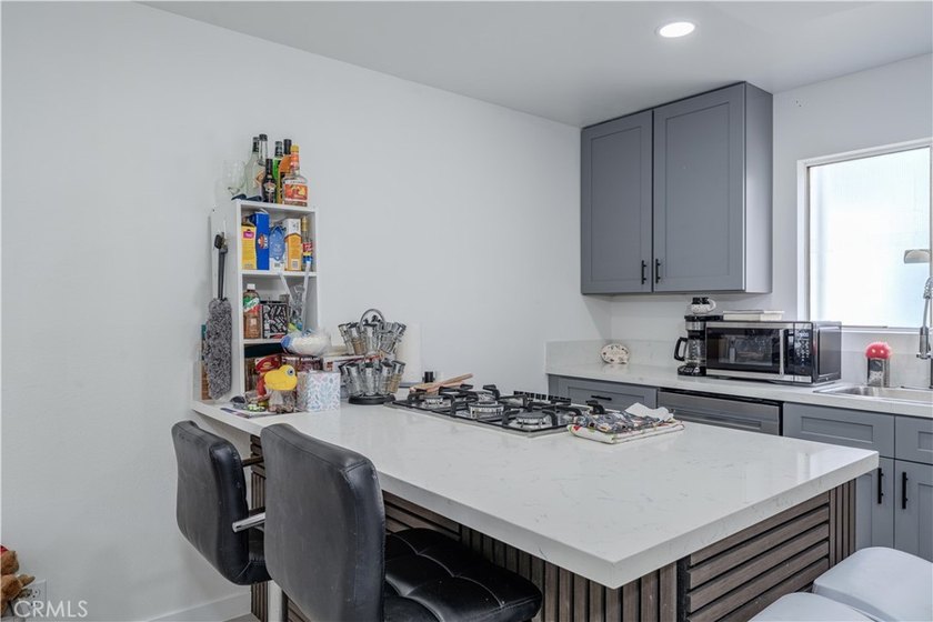 Welcome to this beautifully renovated first-level condominium in - photo 8