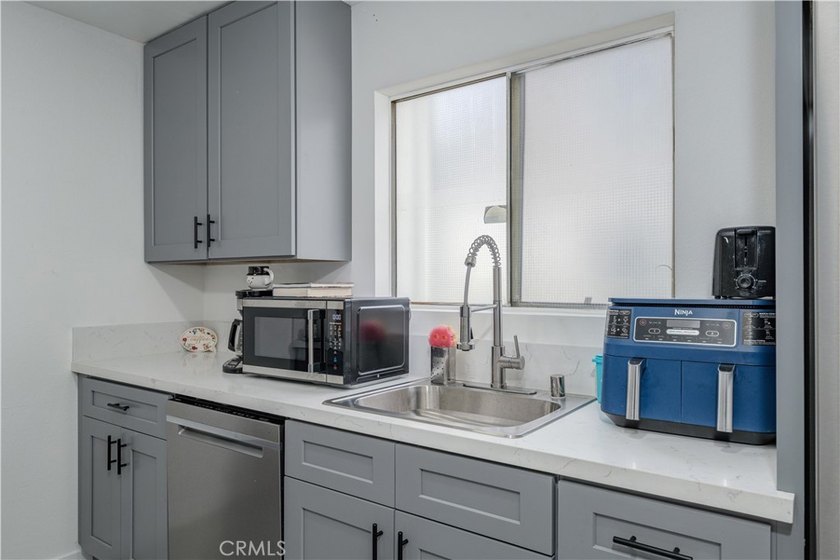 Welcome to this beautifully renovated first-level condominium in - photo 9