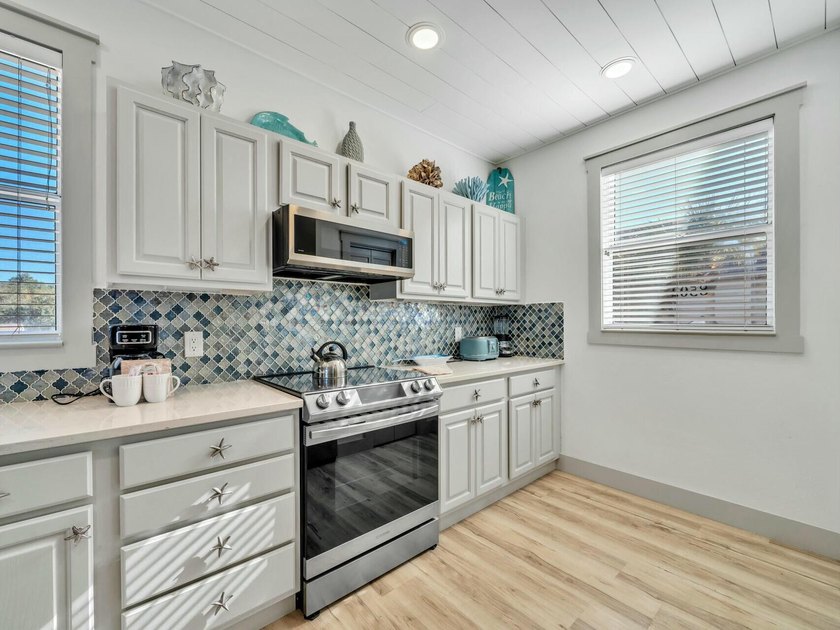This TOTALLY renovated unit is a must see for anyone looking for - photo 11