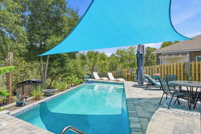 Rare opportunity to purchase this pool home with water views! - photo 4