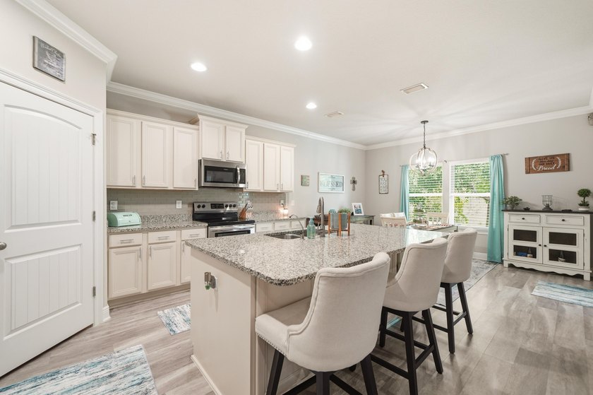 Rare opportunity to purchase this pool home with water views! - photo 8