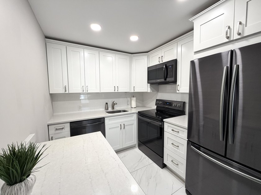 Tastefully updated condo located in a desirable 55+ gated - photo 2