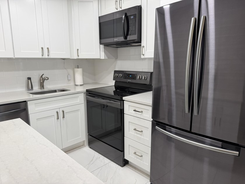 Tastefully updated condo located in a desirable 55+ gated - photo 3