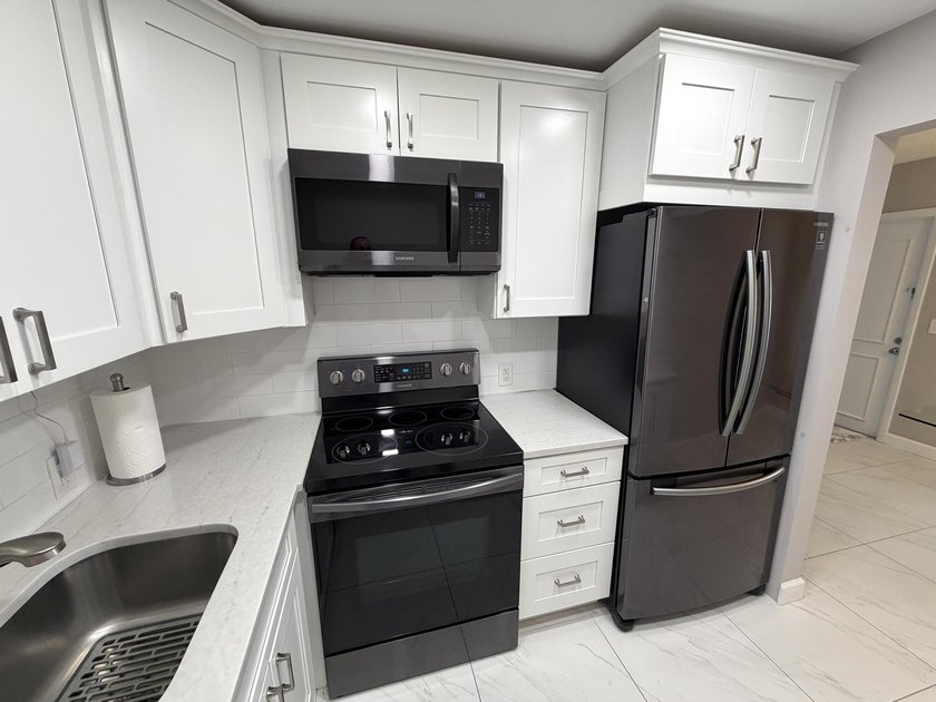 Tastefully updated condo located in a desirable 55+ gated - photo 5