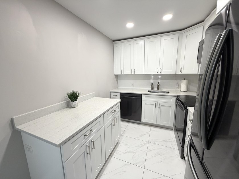 Tastefully updated condo located in a desirable 55+ gated - photo 6