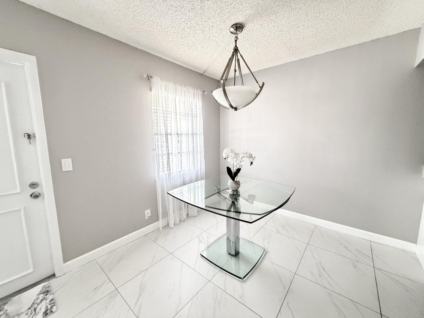 Tastefully updated condo located in a desirable 55+ gated - photo 8