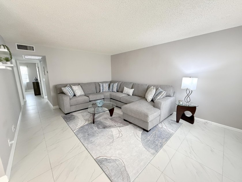 Tastefully updated condo located in a desirable 55+ gated - photo 9