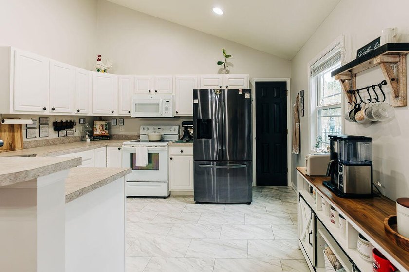Welcome to this charming 3-bedroom, 2-bathroom home featuring a - photo 9