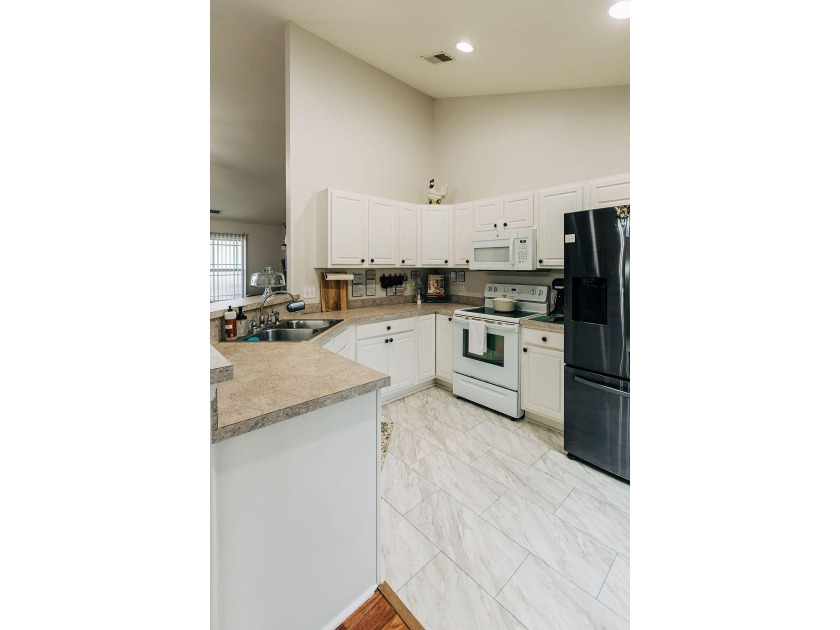 Welcome to this charming 3-bedroom, 2-bathroom home featuring a - photo 10