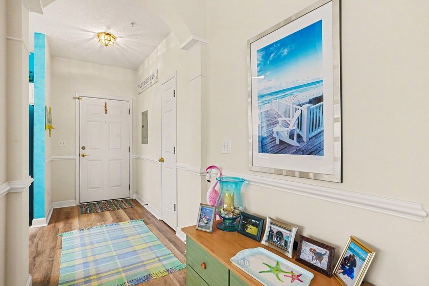 Welcome to this bright and beachy 2-bedroom, 2-bath end-unit - photo 3