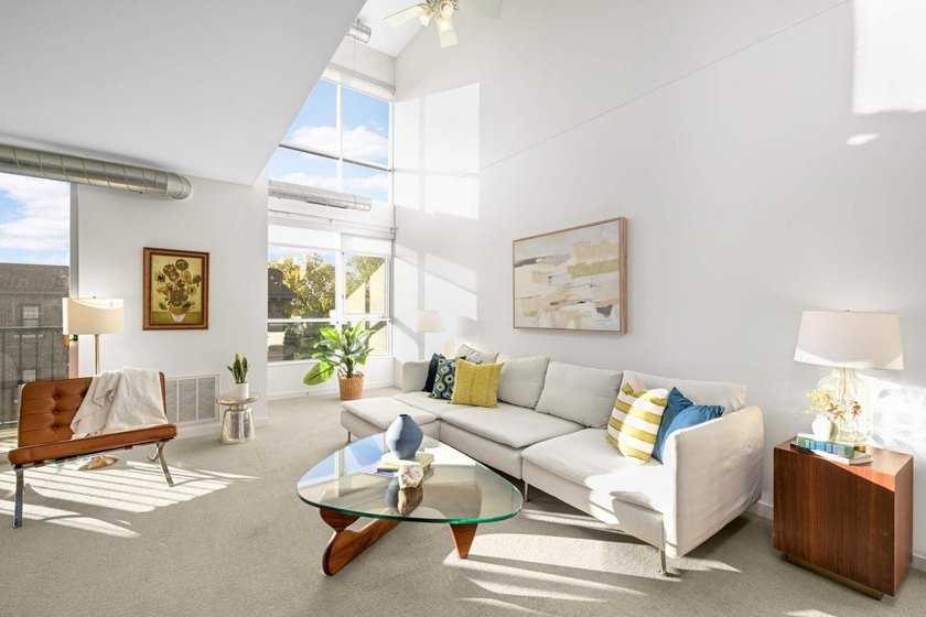 This stylish two story loft offers modern living with all the - photo 2