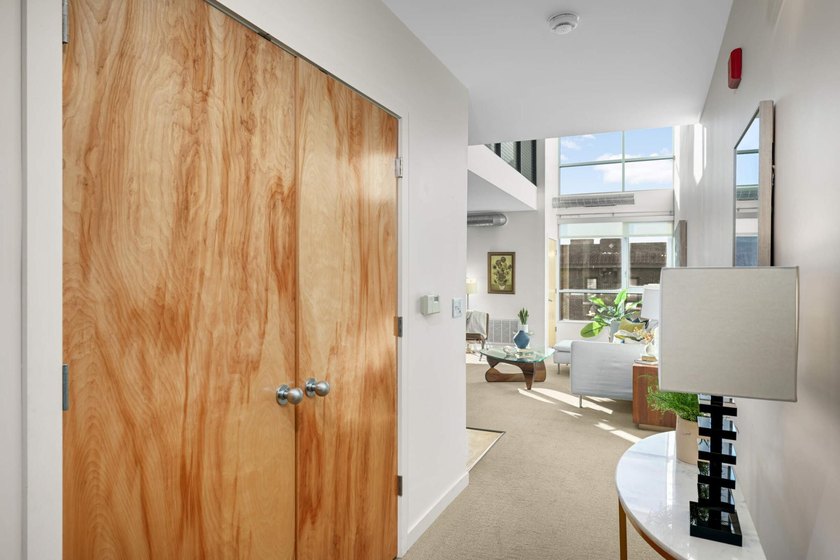 This stylish two story loft offers modern living with all the - photo 4