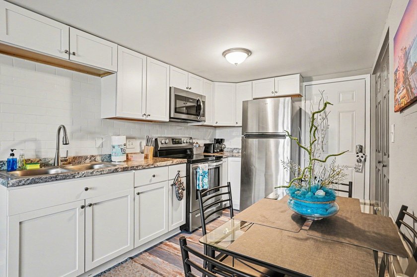 Fully remodeled unit with a lovely pond view in the heart of the - photo 7