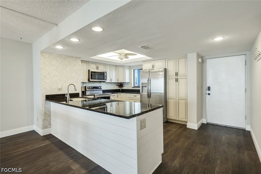 This beautifully updated 6th-floor end unit with a side balcony - photo 11