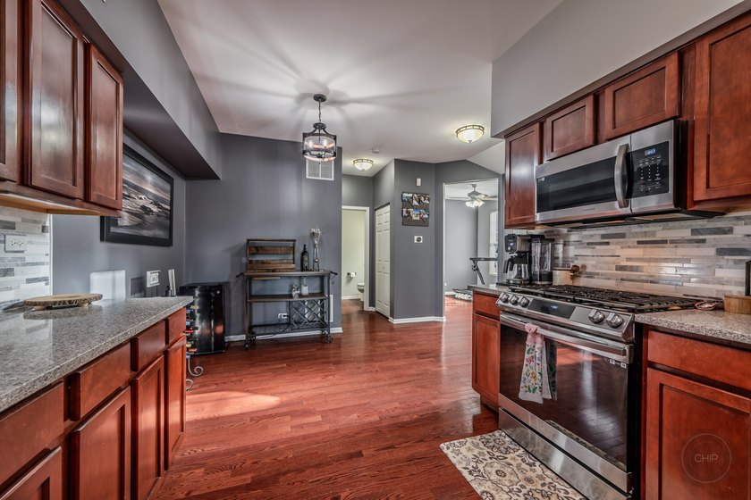 Welcome to this beautifully UPDATED END-UNIT townhome in the - photo 8
