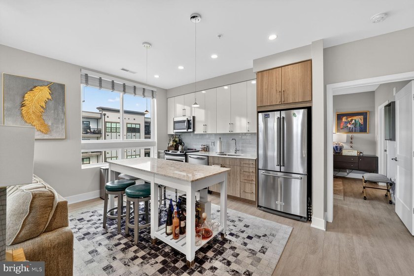 Experience elevated living in this rarely available corner - photo 8