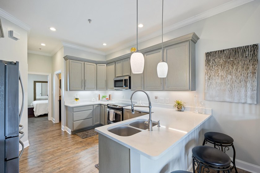 Welcome to The Plaza, a boutique 12-unit condominium located in - photo 6