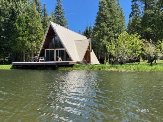 The main A-frame house and two smaller A-frame cabins over - photo 4