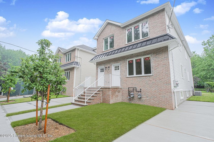 NEW CONSTRUCTION! Beautiful TWO family custom 6 over 6 home - photo 3
