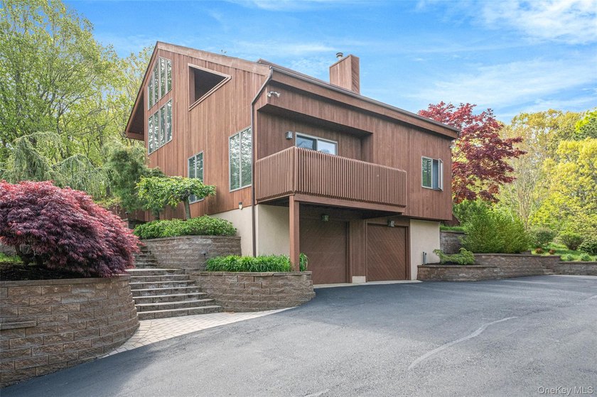 Set within the quiet Rolling Woods neighborhood on a shy acre at - photo 6