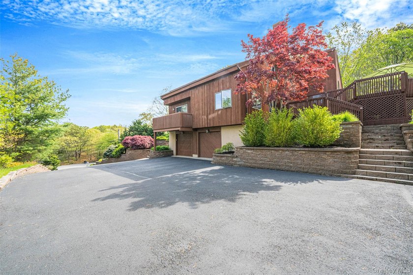 Set within the quiet Rolling Woods neighborhood on a shy acre at - photo 7
