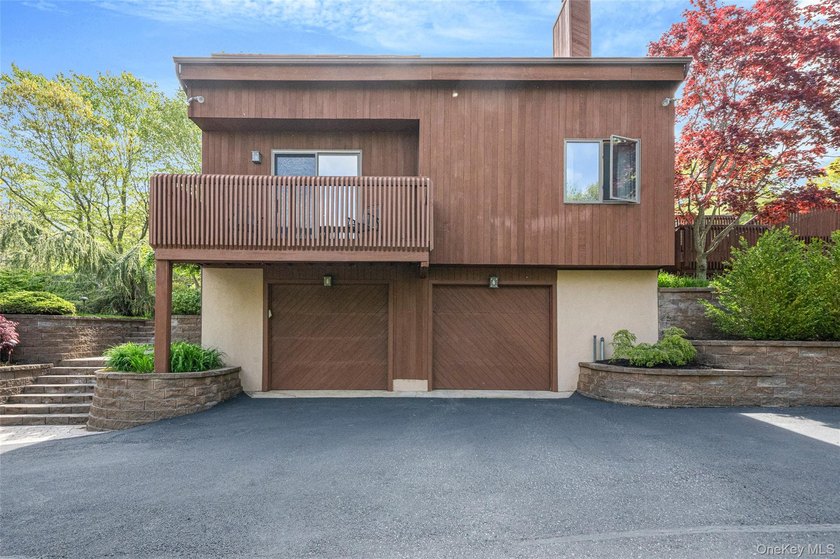 Set within the quiet Rolling Woods neighborhood on a shy acre at - photo 8