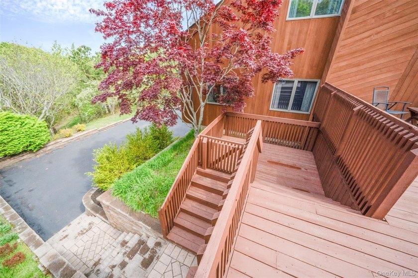 Set within the quiet Rolling Woods neighborhood on a shy acre at - photo 10