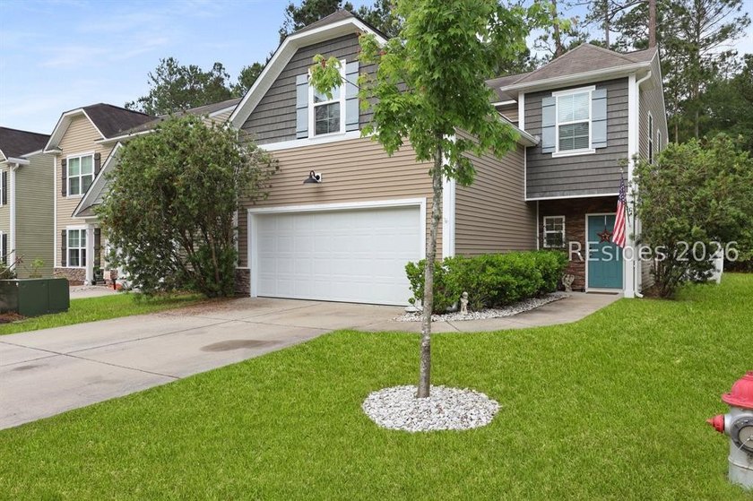 Offered at $400,000, this beautifully maintained 4-bedroom, 2 - photo 2
